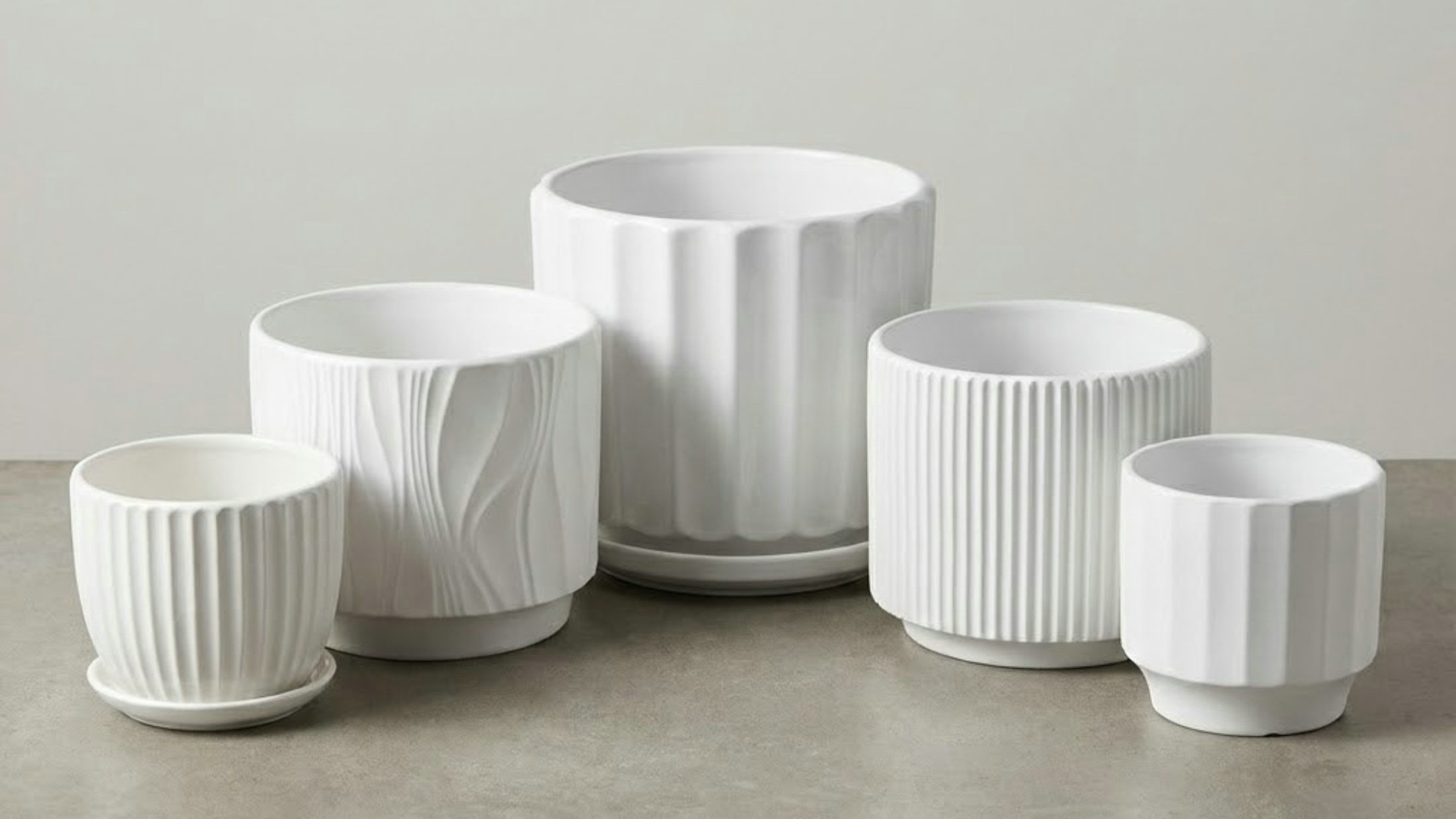Textured ceramic planters in a collection display